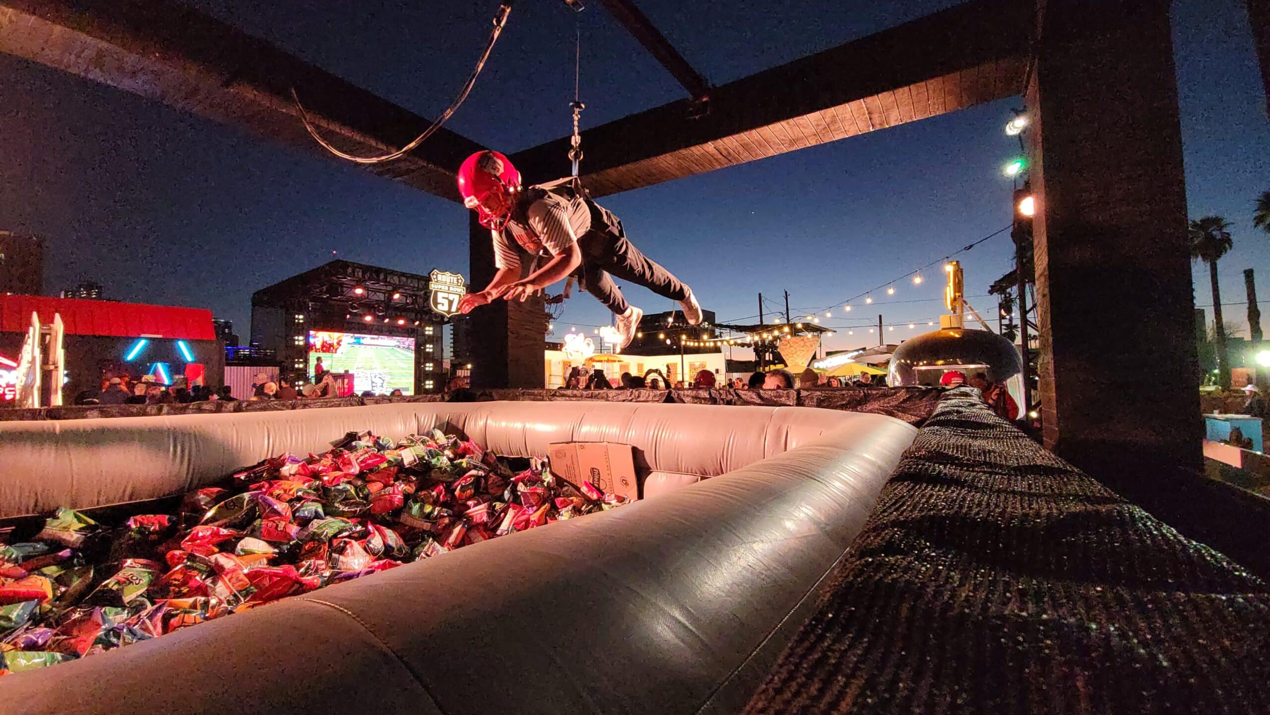 Human claw machine interactive entertainment at an outdoor event