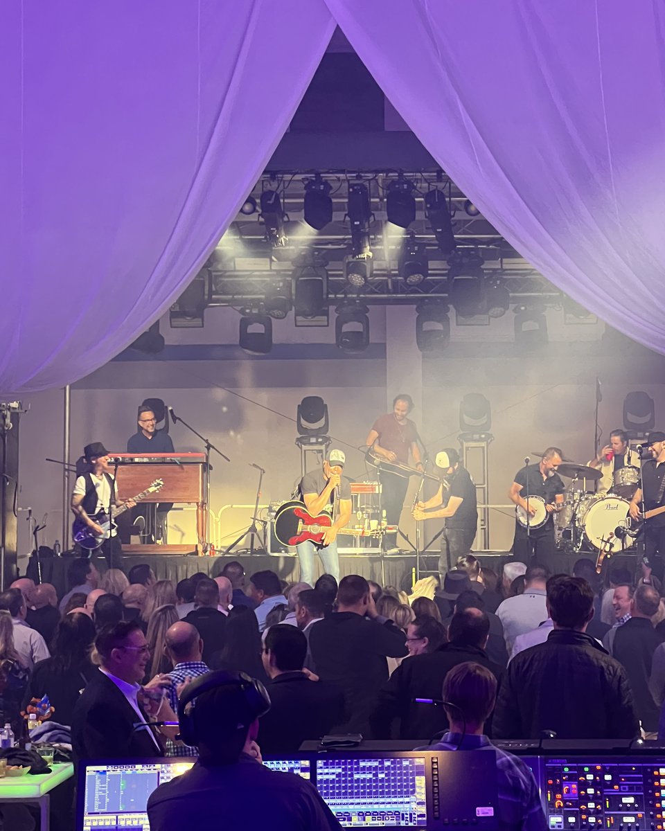 Darius Rucker performing on stage at a private event